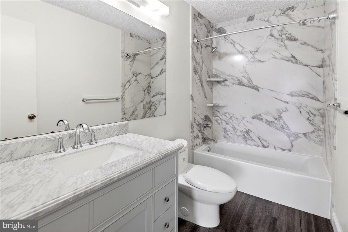 28 Holly Court Hamilton, NJ 08619 - Photo 22 of 29 a bathroom with a granite countertop sink toilet and shower