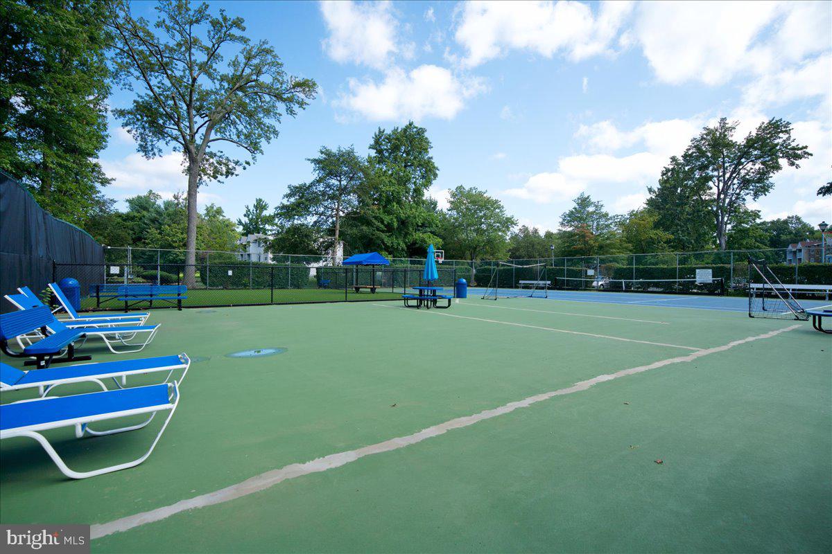 28 Holly Court Hamilton, NJ 08619 - Photo 26 of 29 a view of a tennis ground with large trees