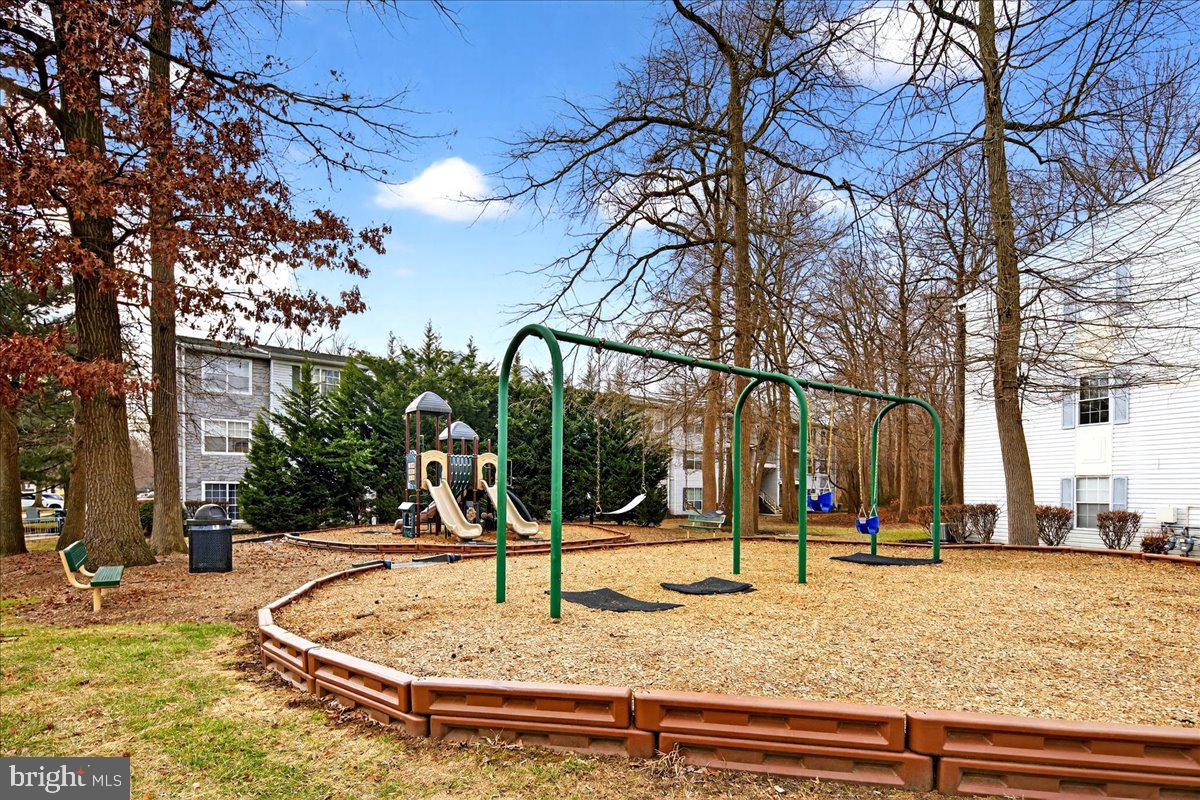 28 Holly Court Hamilton, NJ 08619 - Photo 6 of 29 a view of a park with swings
