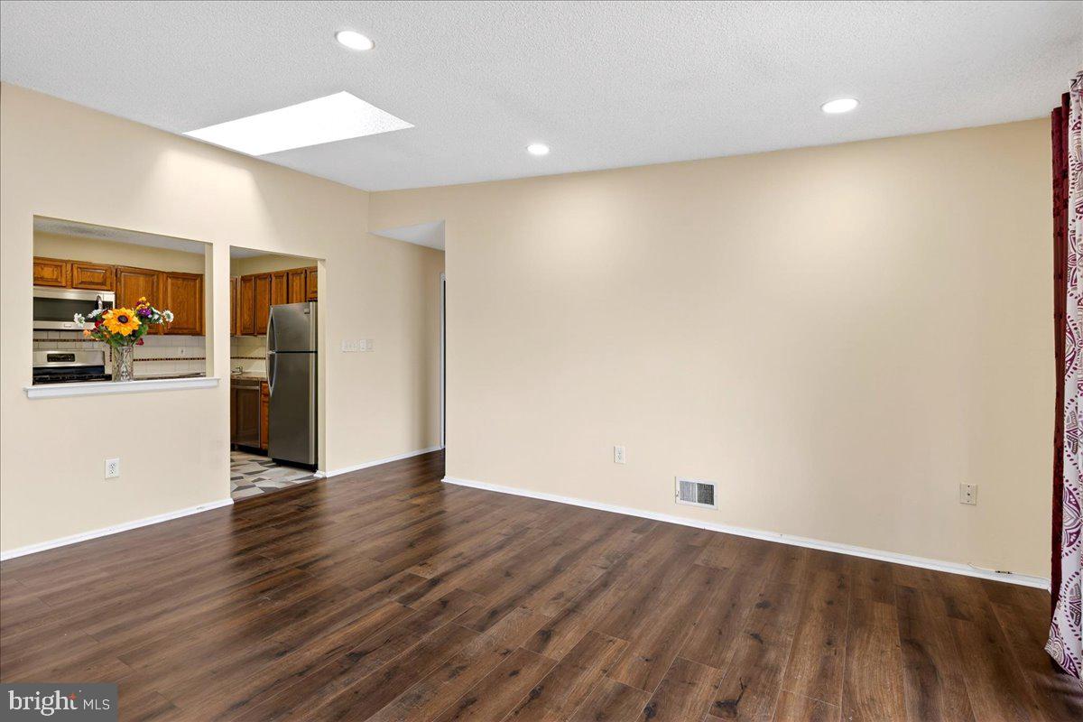 28 Holly Court Hamilton, NJ 08619 - Photo 10 of 29 an empty room with wooden floor and closet