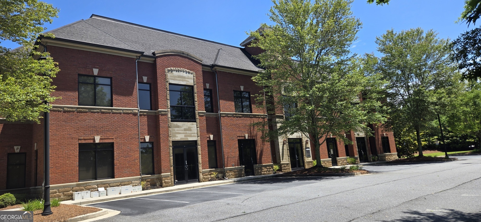10475 Medlock Bridge Road, Unit 900 Duluth, GA 30097 - Photo 13 of 13 front view of house with a pathway