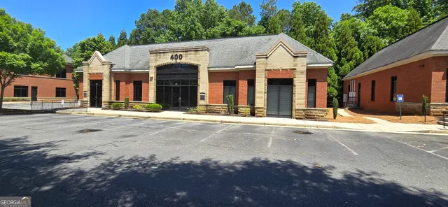 a view of a house with a yard porch and sitting area