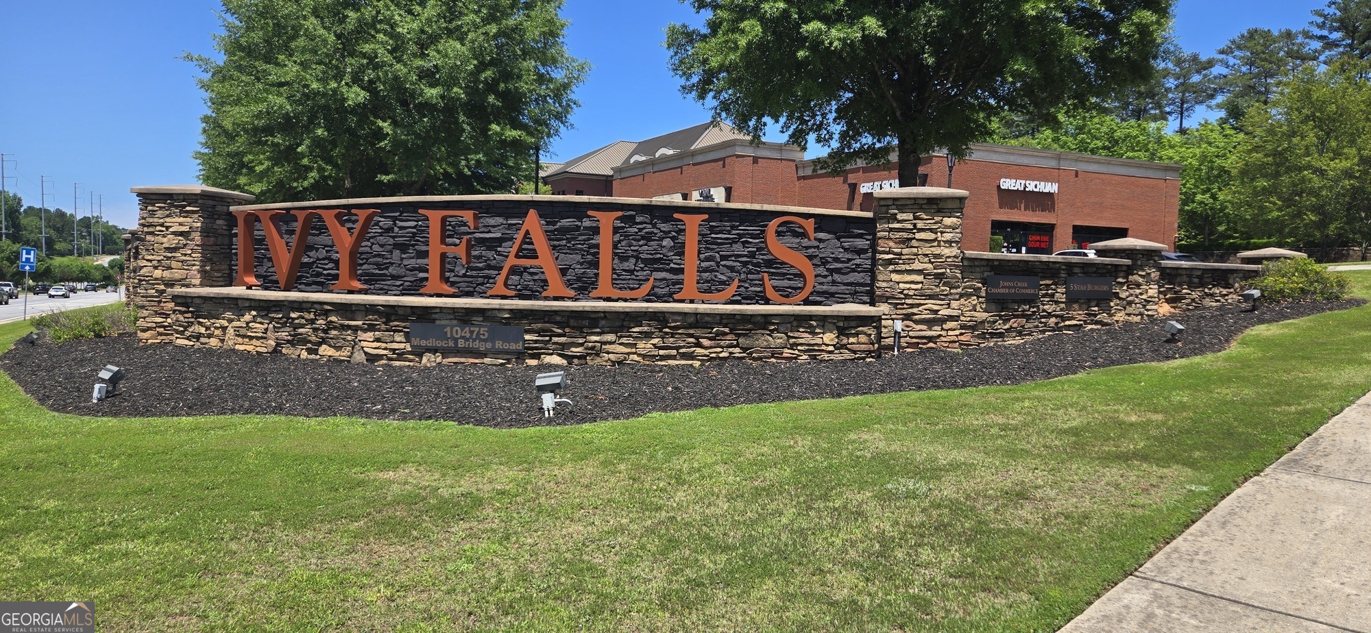 10475 Medlock Bridge Road, Unit 900 Duluth, GA 30097 - Photo 10 of 13 a view of a house with a yard porch and sitting area