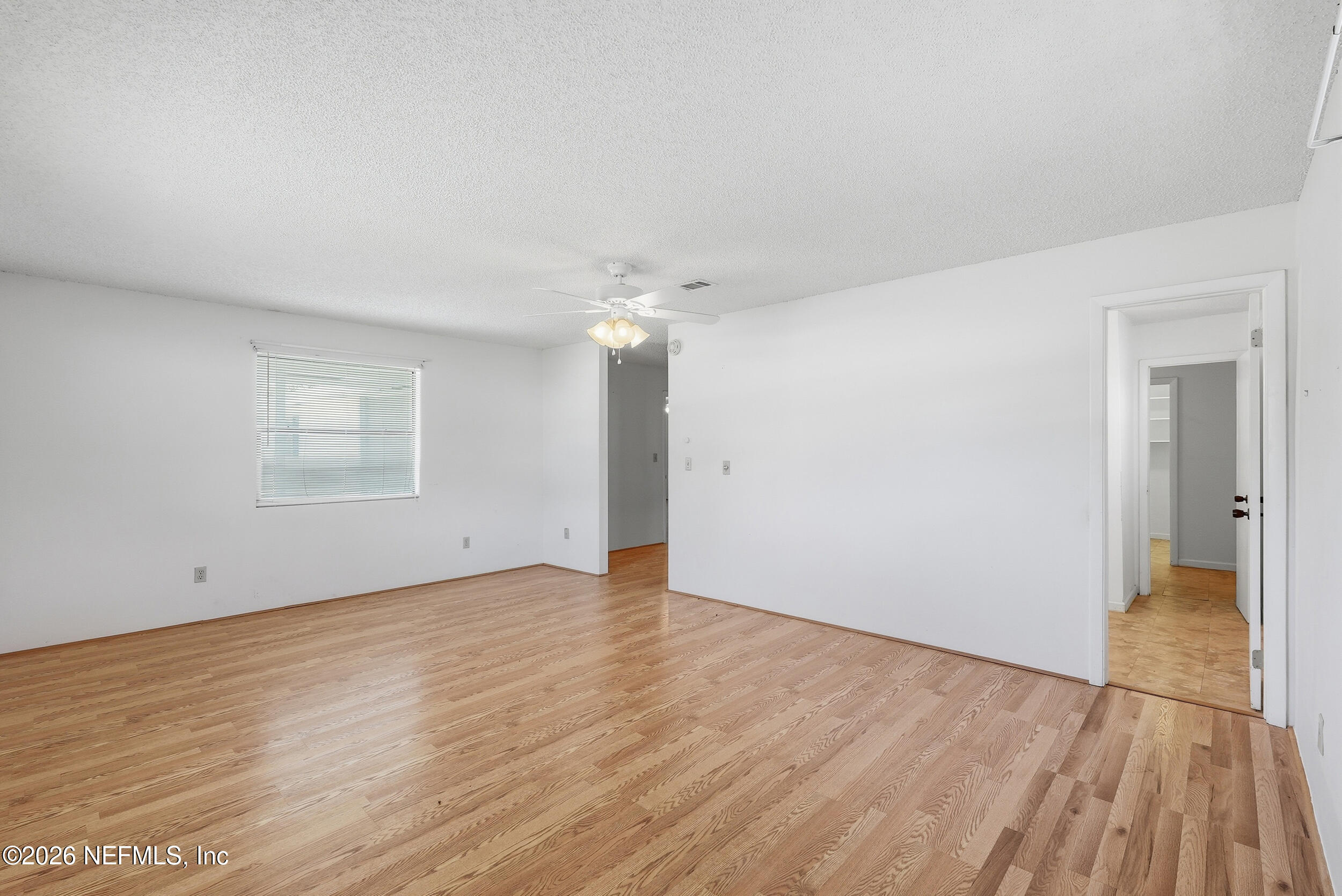 7593 Silver Sands Road Keystone Heights, FL 32656 - Photo 21 of 36 a view of an empty room and wooden floor