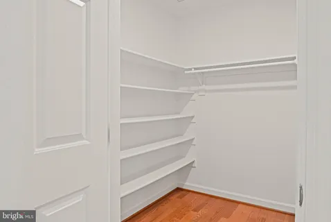 a bathroom with a sink vanity and mirror