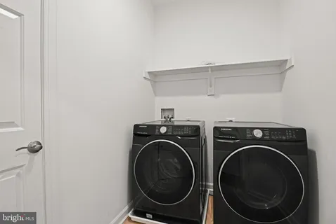 a picture of a bench in front of a wall