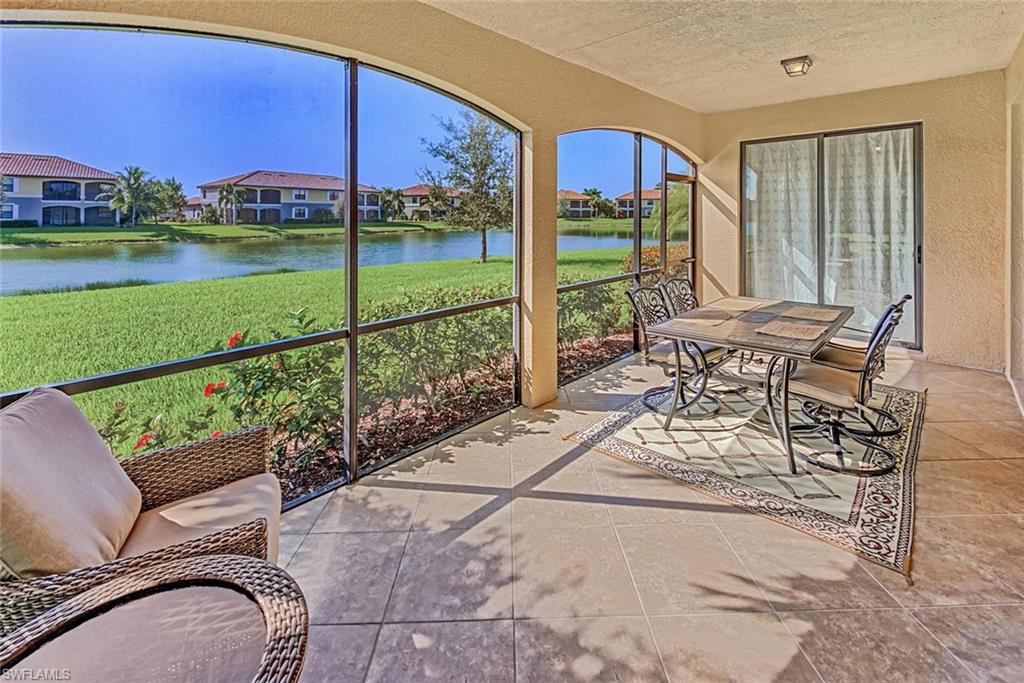 9126 Napoli Court, Unit 101 Naples, FL 34113 - Photo 20 of 32 a view of a patio with a yard