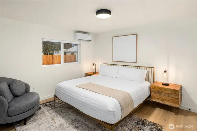 a bedroom with bed and window