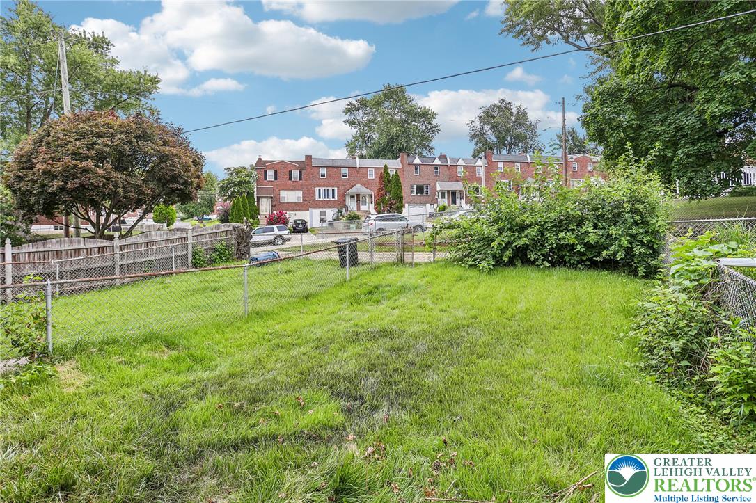 4008 Powell Road Brookhaven, PA 19015 - Photo 33 of 36 A well-maintained yard provides ample space for outdoor activities, enclosed by secure fencing.