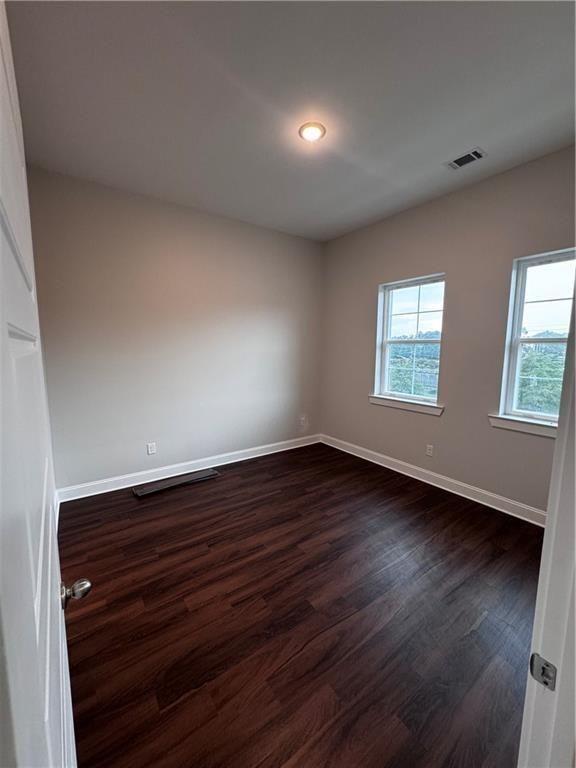 1777 Temple Avenue, Unit N Atlanta, GA 30337 - Photo 15 of 22 a view of an empty room with wooden floor and a window