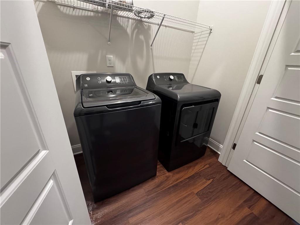 1777 Temple Avenue, Unit N Atlanta, GA 30337 - Photo 17 of 22 a utility room with wooden floor washer and dryer