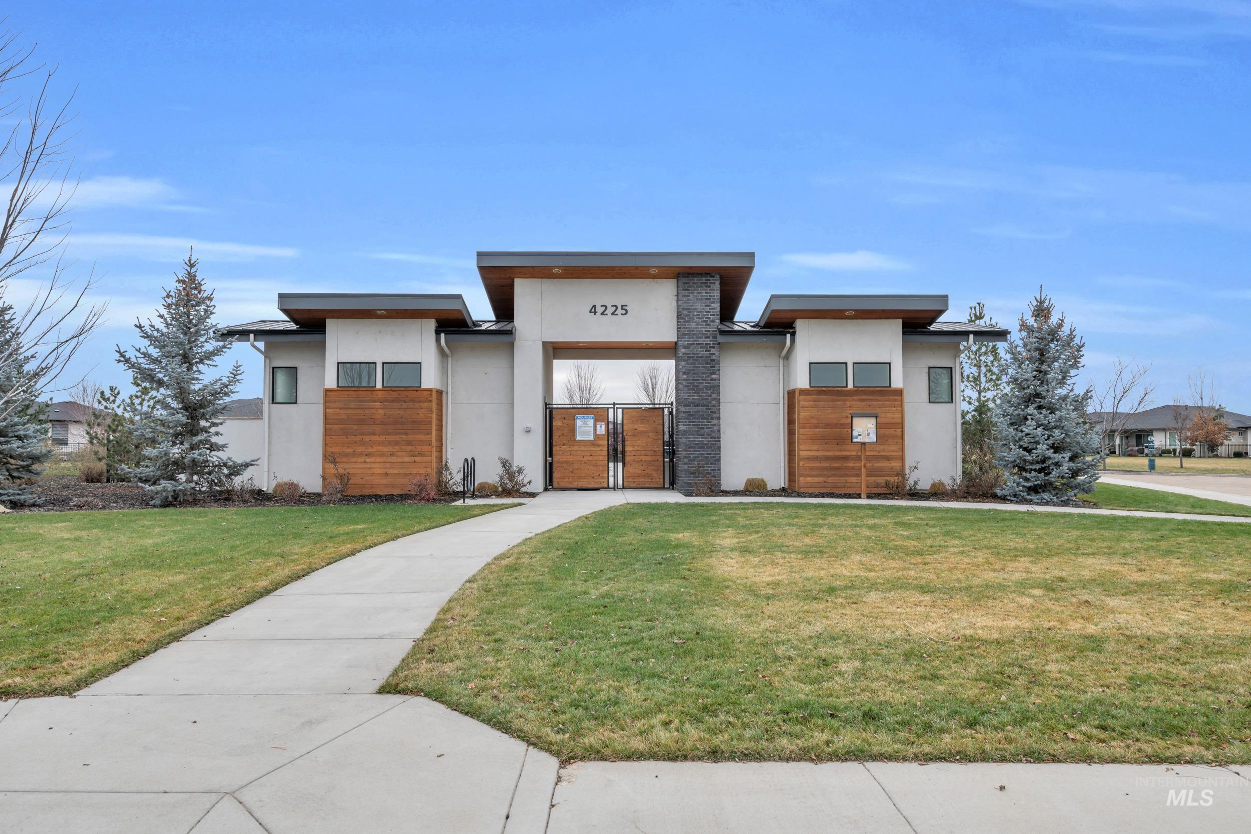 4447 East Copper Point Drive Meridian, ID 83642 - Photo 36 of 41 Modern home featuring stucco siding and a gate