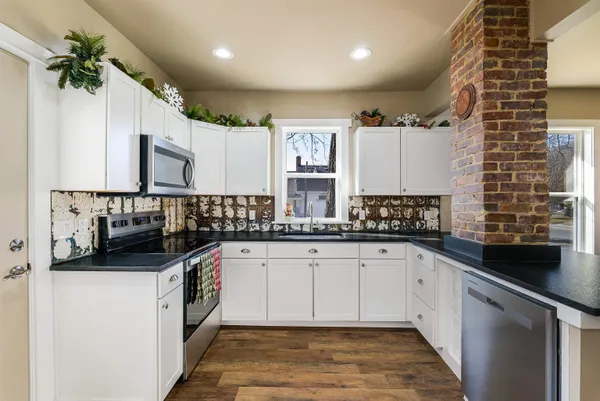 a kitchen with a sink and cabinets