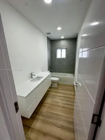 a view of a small space with wooden floor