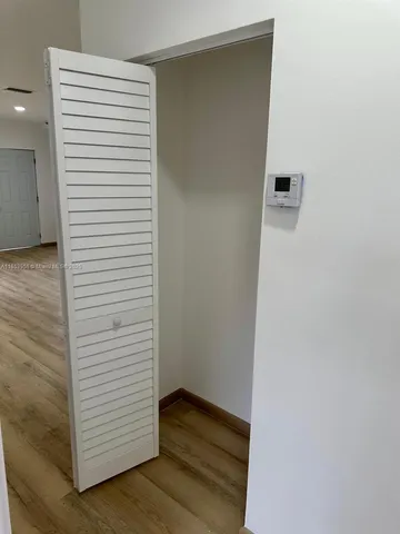 a bathroom with a sink mirror and toilet