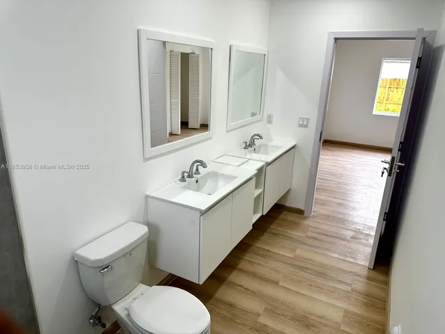 a view of an entryway with wooden floor