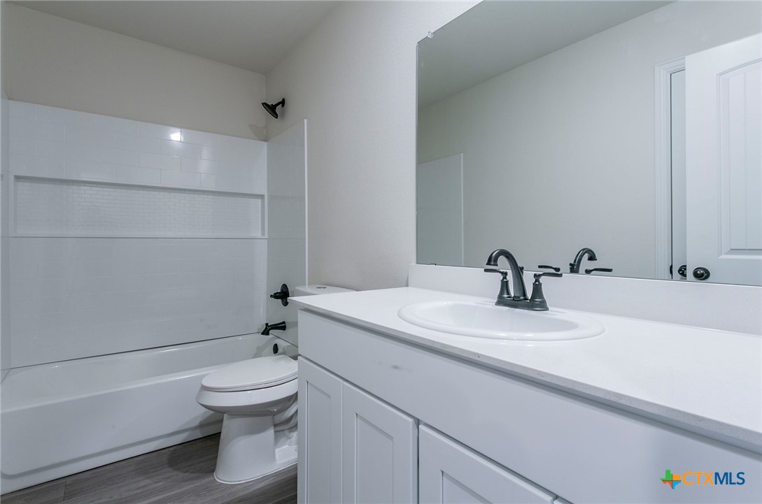 3817 Poteet Court Temple, TX 76504 - Photo 10 of 13 a bathroom with a sink toilet and shower