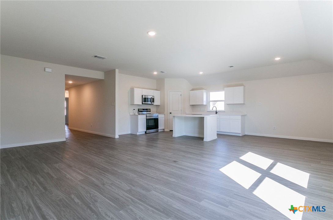 3817 Poteet Court Temple, TX 76504 - Photo 2 of 13 a view of kitchen with wooden floor and electronic appliances