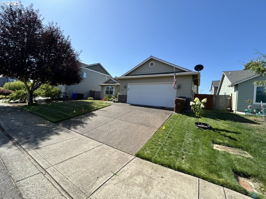 736 Kelsey Loop Molalla, OR 97038 - Photo 3 of 21 a front view of a house with a yard
