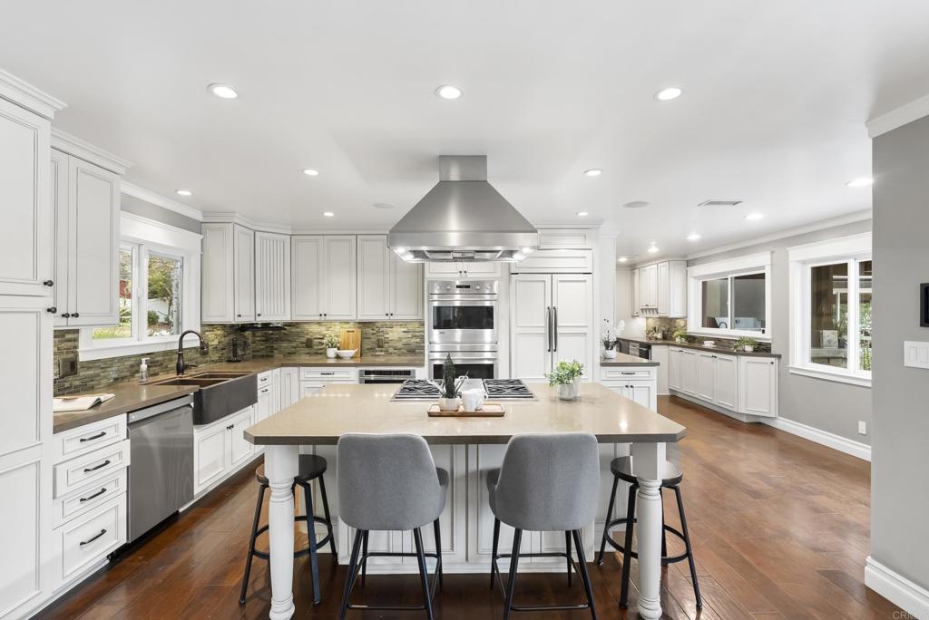 4847 Vita Road La Mesa, CA 91941 - Photo 18 of 73 a kitchen with counter space dining table and chairs