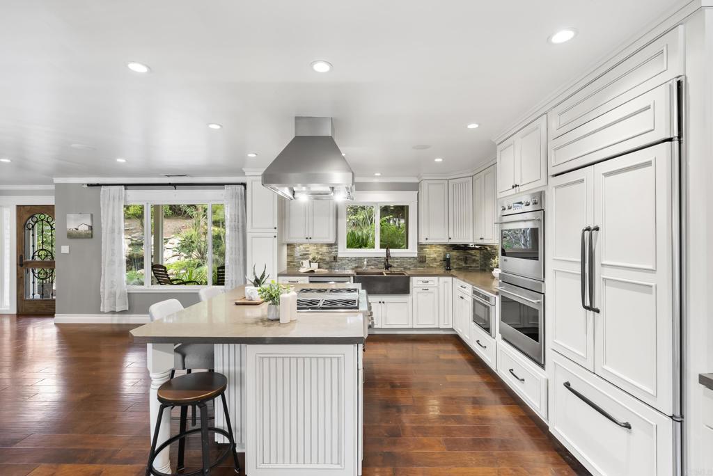 4847 Vita Road La Mesa, CA 91941 - Photo 20 of 73 an open kitchen with white cabinets and stainless steel appliances