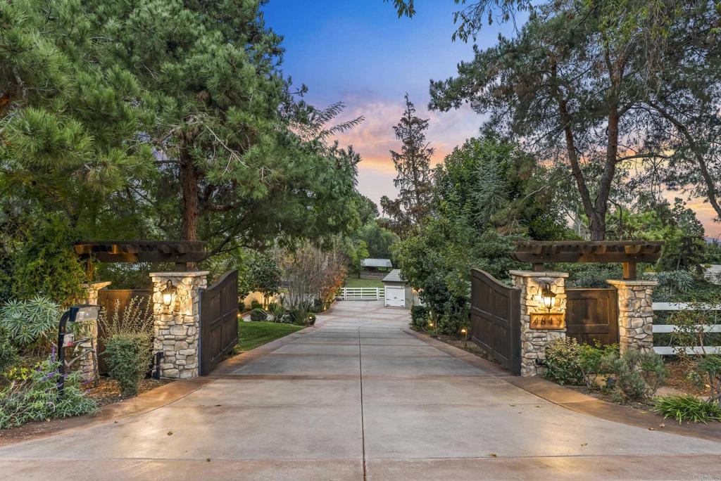4847 Vita Road La Mesa, CA 91941 - Photo 2 of 73 a view of a street with potted plants and large trees