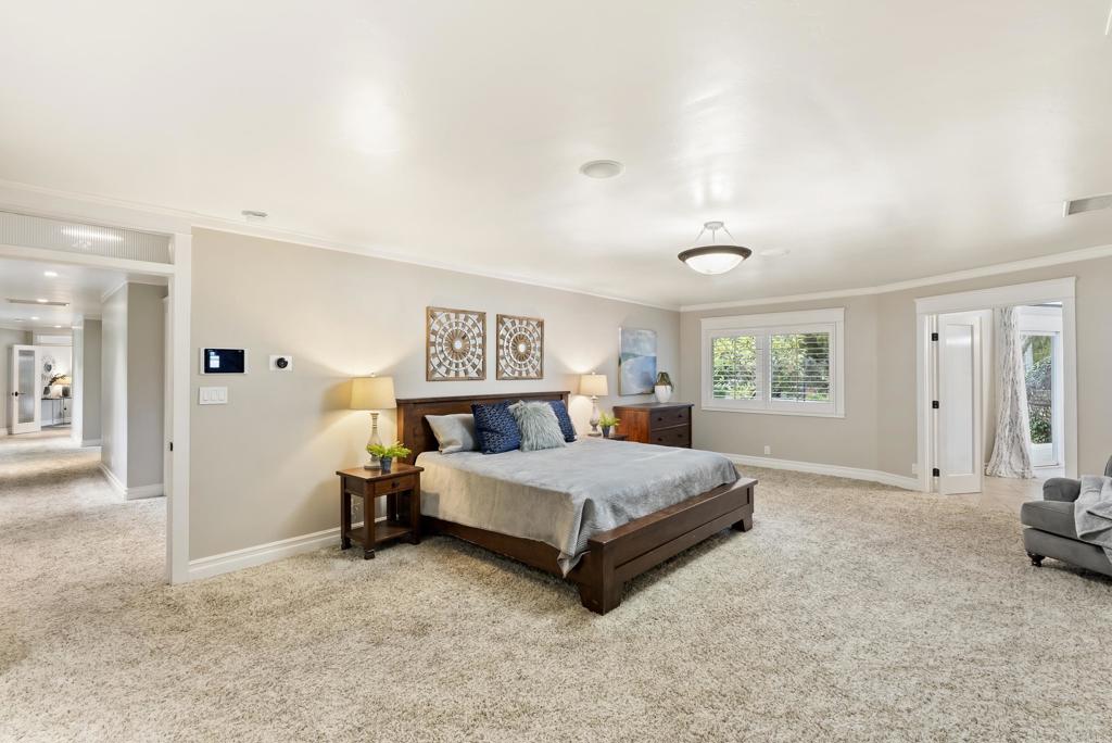 4847 Vita Road La Mesa, CA 91941 - Photo 24 of 73 a spacious bedroom with a bed and a large window