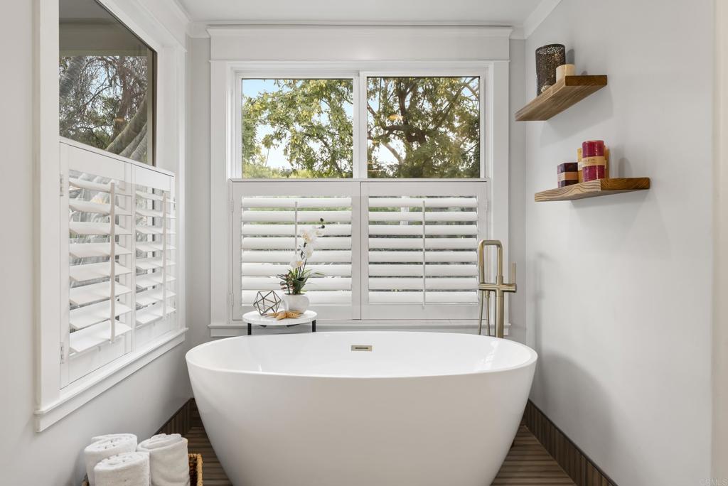 4847 Vita Road La Mesa, CA 91941 - Photo 30 of 73 a white bath tub sitting next to a window