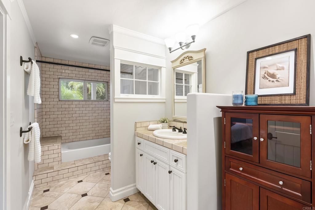4847 Vita Road La Mesa, CA 91941 - Photo 35 of 73 a bathroom with a sink and a mirror