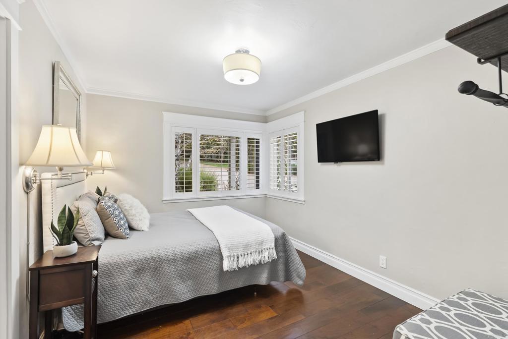 4847 Vita Road La Mesa, CA 91941 - Photo 39 of 73 a bedroom with a bed and a flat screen tv