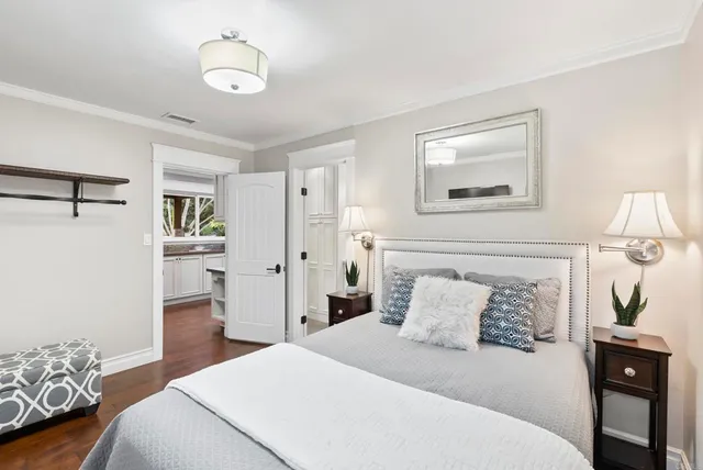 a view of a patio with table and chairs and potted plants