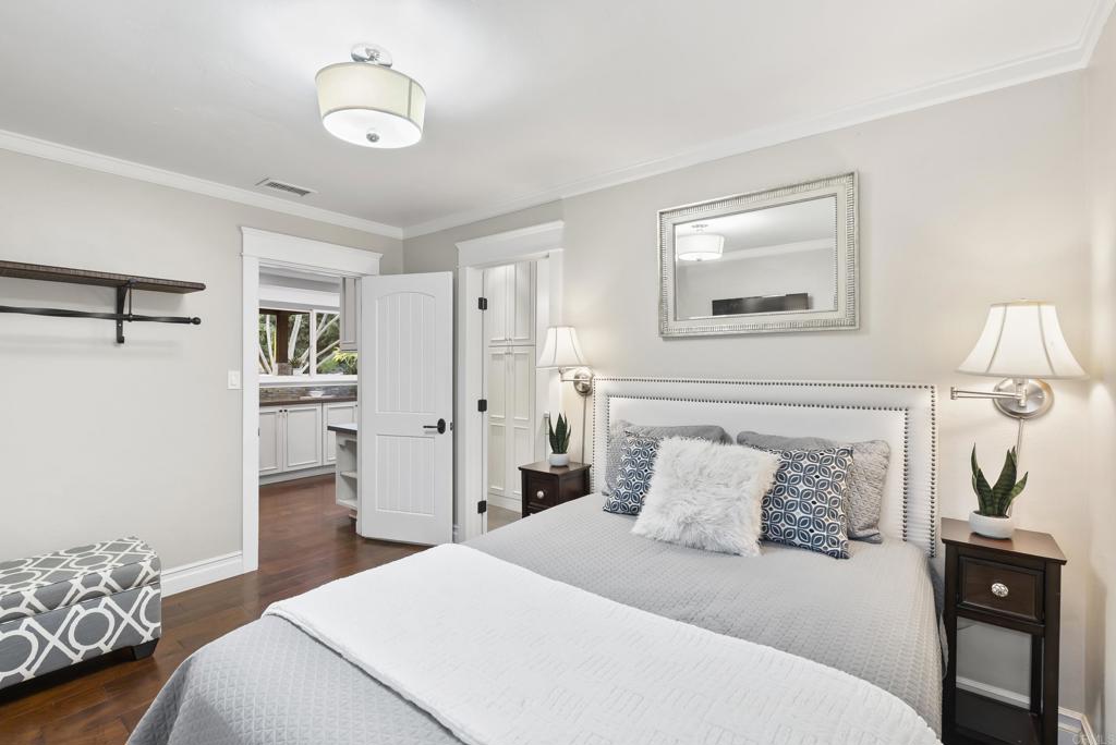 4847 Vita Road La Mesa, CA 91941 - Photo 40 of 73 a bedroom with a bed and a chandelier