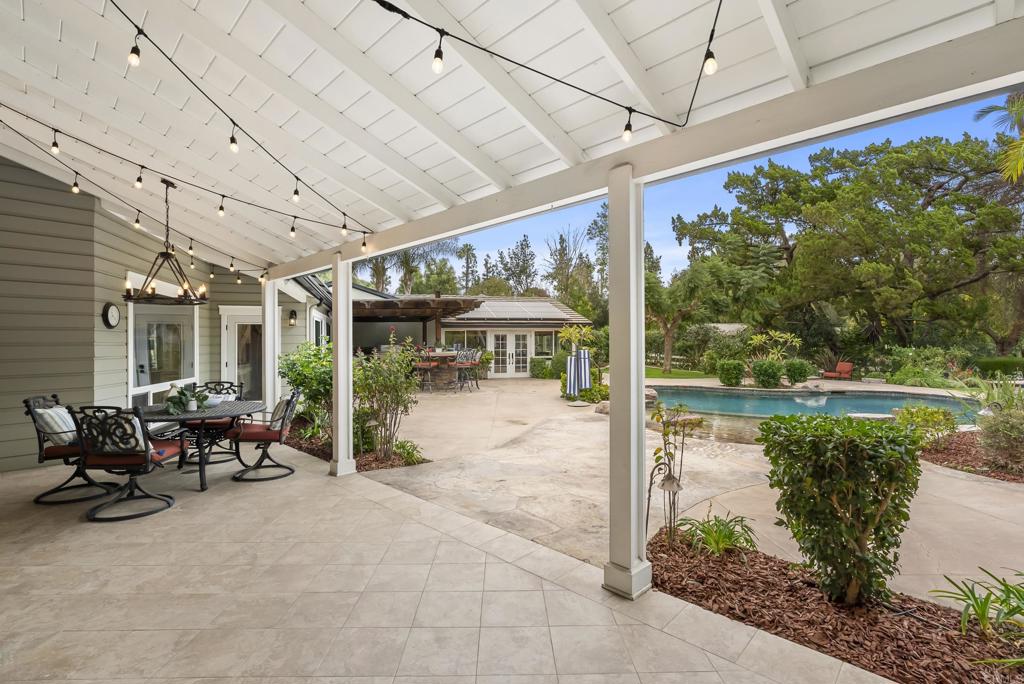 4847 Vita Road La Mesa, CA 91941 - Photo 46 of 73 a view of a patio with table and chairs potted plants with wooden floor