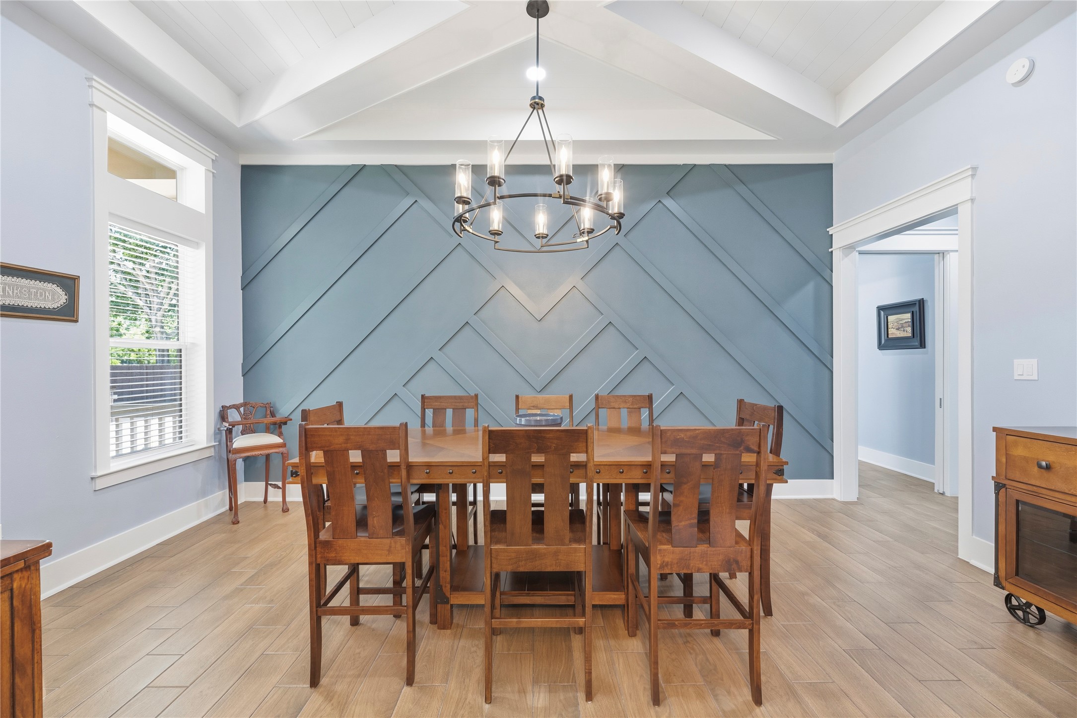 4607 Clayhead Road Richmond, TX 77406 - Photo 12 of 49 Architecturally striking dining space enhanced by dramatic ceiling lines, designer lighting, and statement wall detailing.