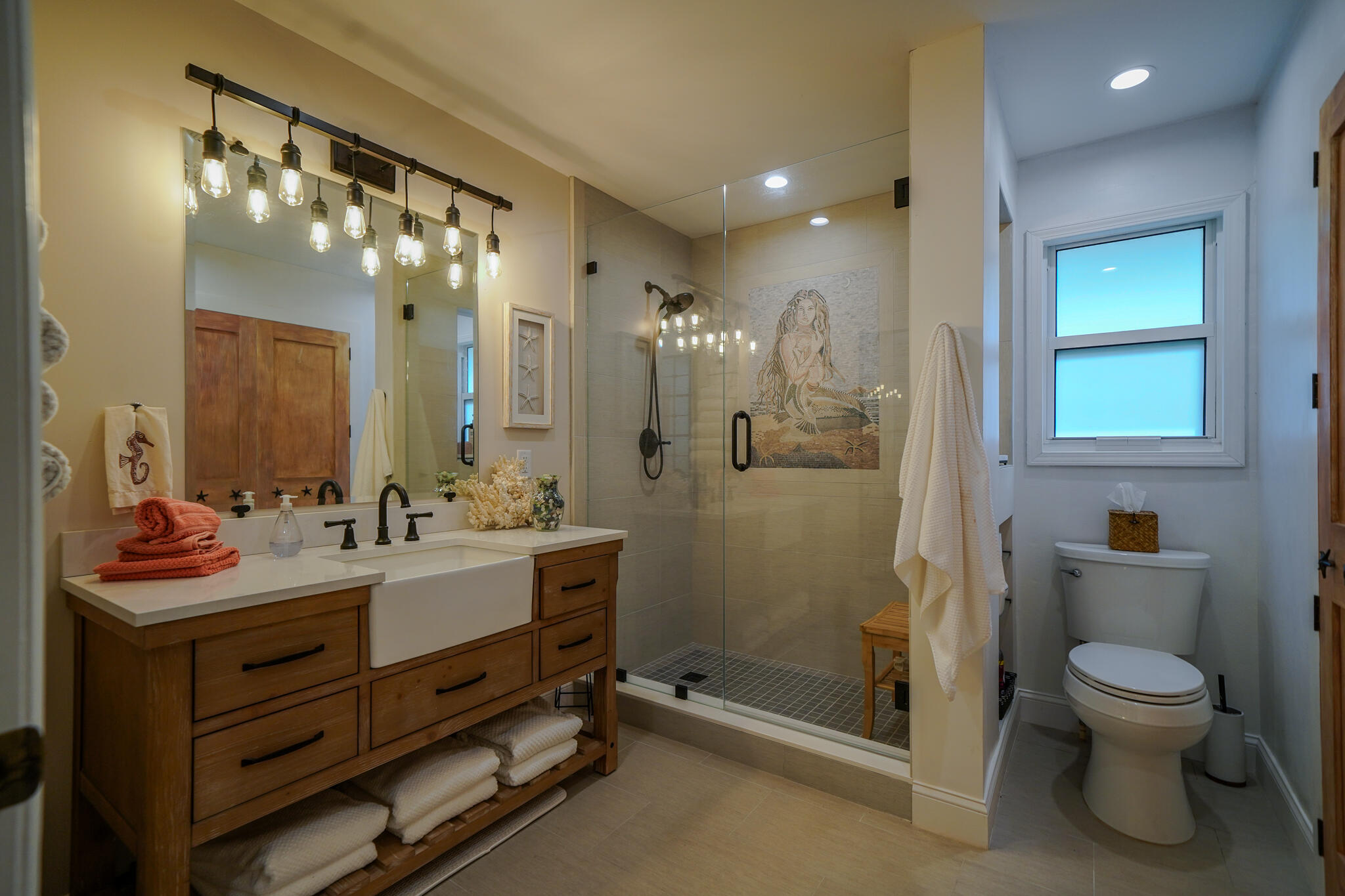 21 Corrine Place Key Largo, FL 33037 - Photo 11 of 46 a bathroom with a toilet sink and mirror