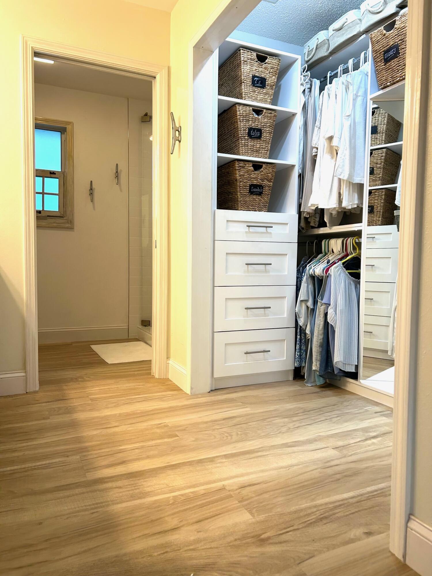 21 Corrine Place Key Largo, FL 33037 - Photo 20 of 46 a view of walk in closet with clothes and shoes