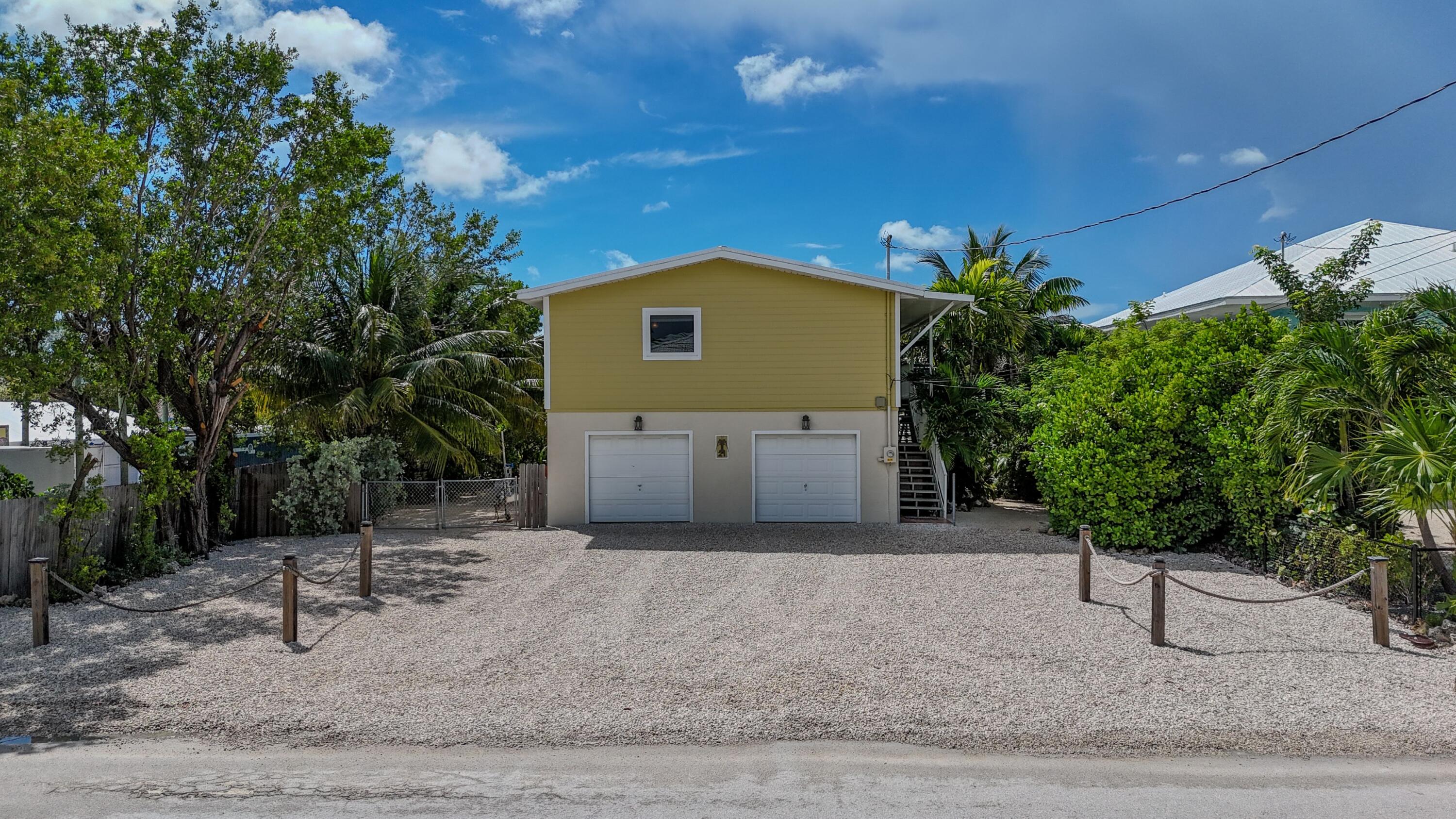 21 Corrine Place Key Largo, FL 33037 - Photo 42 of 46 a front view of a house with garden