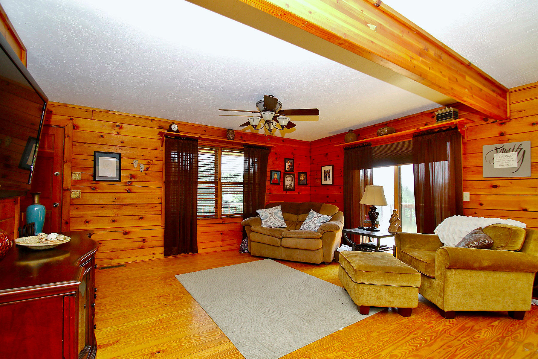 1927 Hatchett Road Penhook, VA 24137 - Photo 11 of 46 a living room with patio furniture and a fireplace