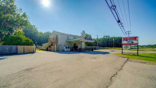 a view of an house with swimming pool and seating space