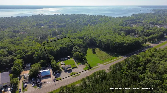 an aerial view of a house yard and mountain view