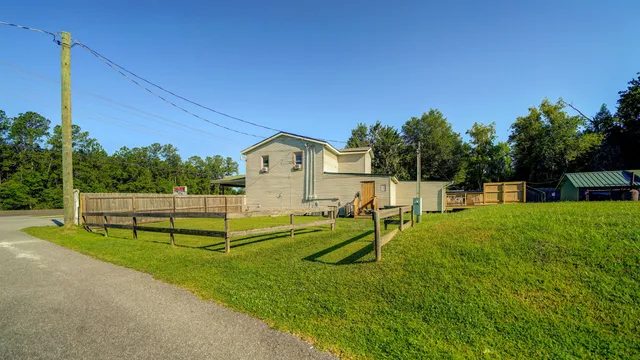 a view of yard with swimming pool and bench