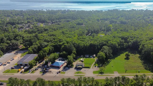 an aerial view of a house with a yard