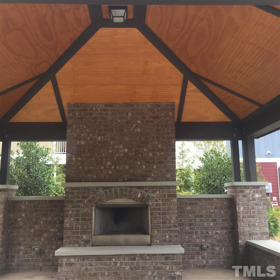 744 Fallon Grove Way Raleigh, NC 27608 - Photo 14 of 14 a outdoor space with a fireplace