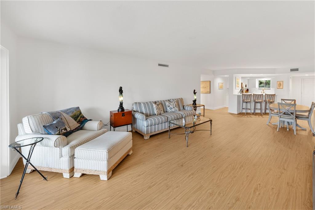 801 Islamorada Boulevard, Unit 22B Punta Gorda, FL 33955 - Photo 17 of 48 a living room with furniture and a table