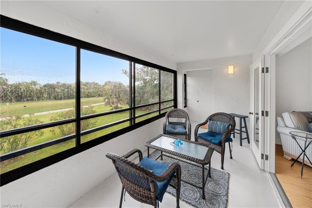 801 Islamorada Boulevard, Unit 22B Punta Gorda, FL 33955 - Photo 18 of 48 a view of a living room and floor to ceiling window or wooden floor