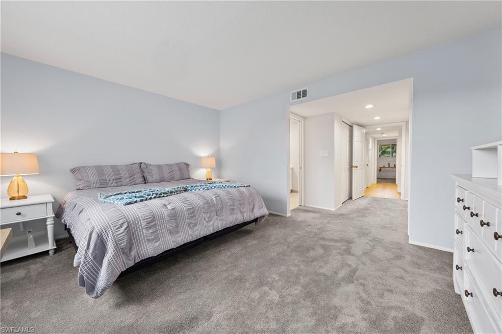 801 Islamorada Boulevard, Unit 22B Punta Gorda, FL 33955 - Photo 21 of 48 a bedroom with a bed and walk in closet