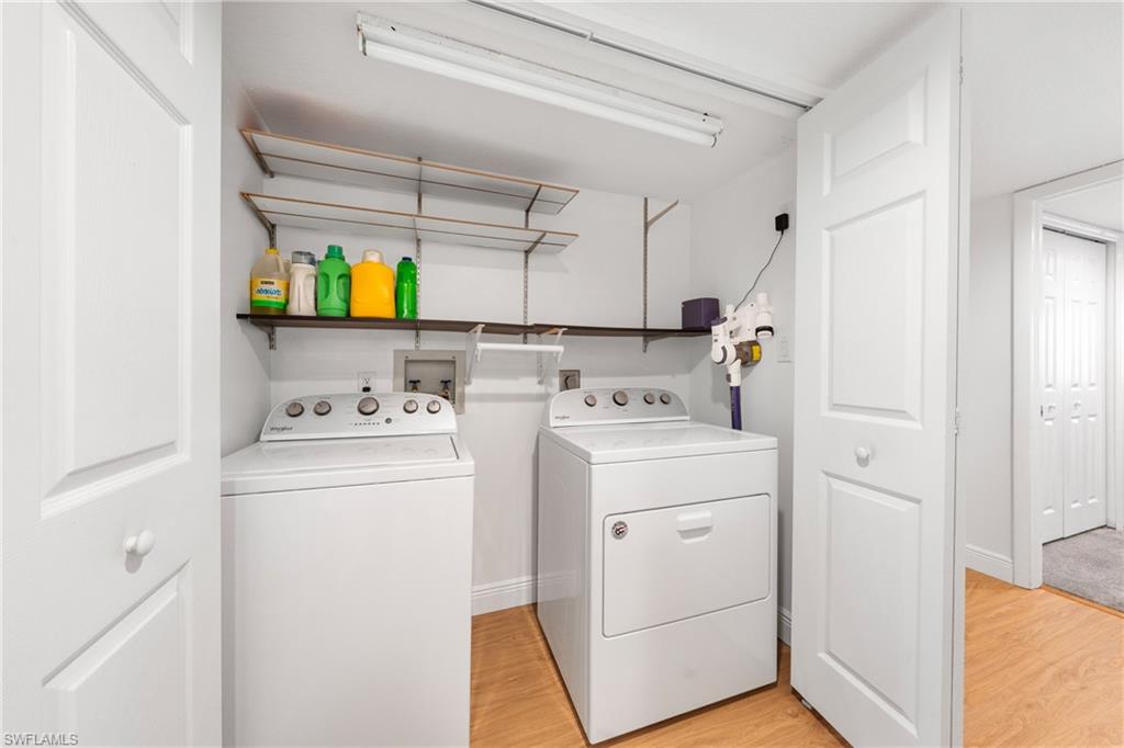801 Islamorada Boulevard, Unit 22B Punta Gorda, FL 33955 - Photo 27 of 48 a utility room with dryer and washer