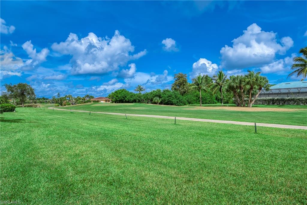 801 Islamorada Boulevard, Unit 22B Punta Gorda, FL 33955 - Photo 29 of 48 a view of a golf course with a lake