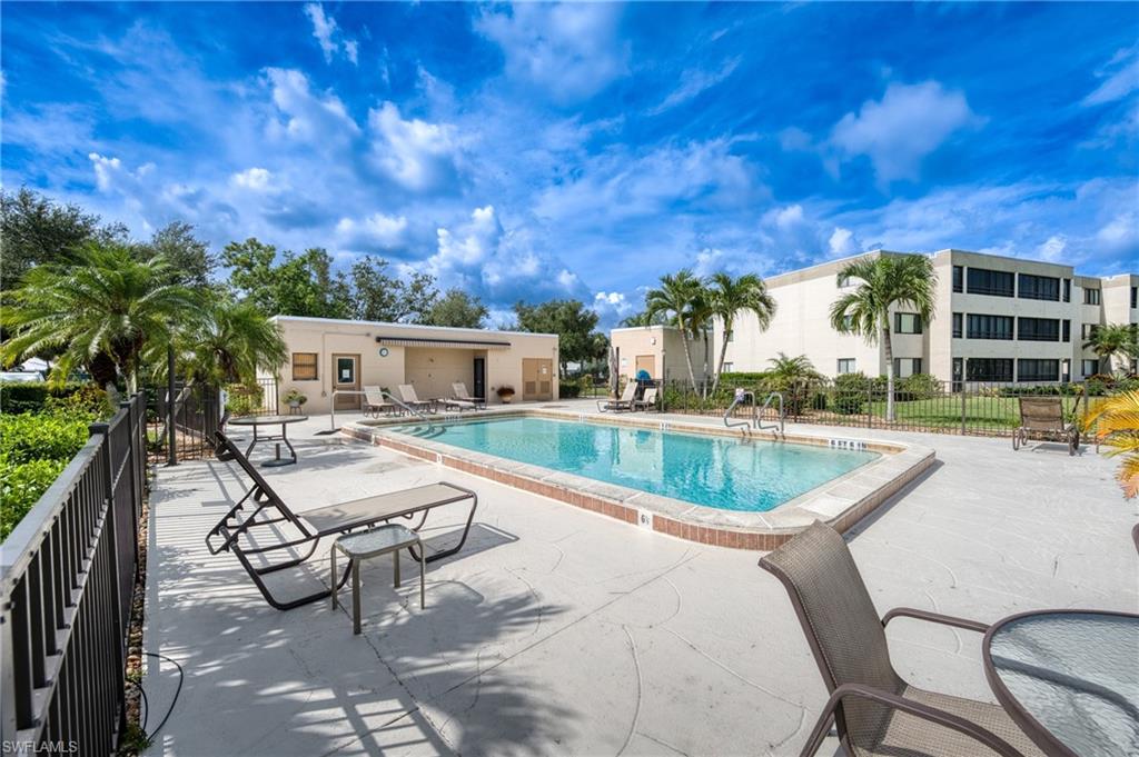 801 Islamorada Boulevard, Unit 22B Punta Gorda, FL 33955 - Photo 30 of 48 a view of a swimming pool with lounge chairs