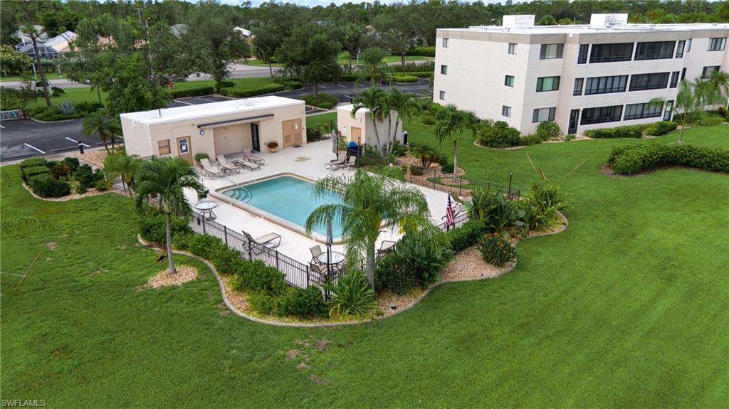 801 Islamorada Boulevard, Unit 22B Punta Gorda, FL 33955 - Photo 31 of 48 a view of a house with a backyard and swimming pool